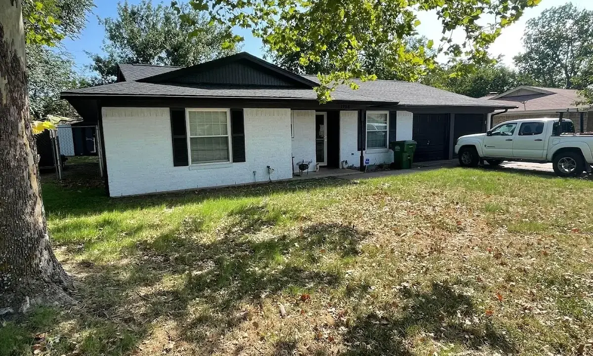 Professional roofing crew working on a residential roof in Woodbridge
